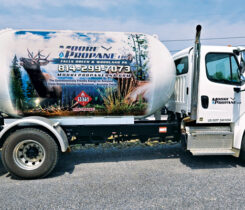 Moore Propane’s truck wrap features two nature scenes: a rainbow trout on the left side and two elk on the right. (Photo by Kelly Moore-Price)