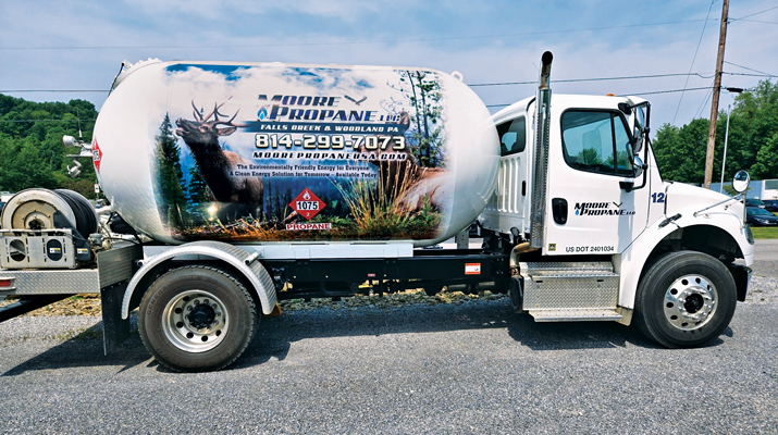 Moore Propane’s truck wrap features two nature scenes: a rainbow trout on the left side and two elk on the right. (Photo by Kelly Moore-Price)