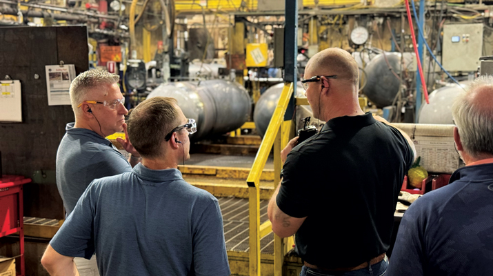 David Graham, right, takes LP Gas’ Brian Kanaba, left, and Brian Richesson on a company tour in Fremont, Ohio. (Photo by Shirnae Richardson)