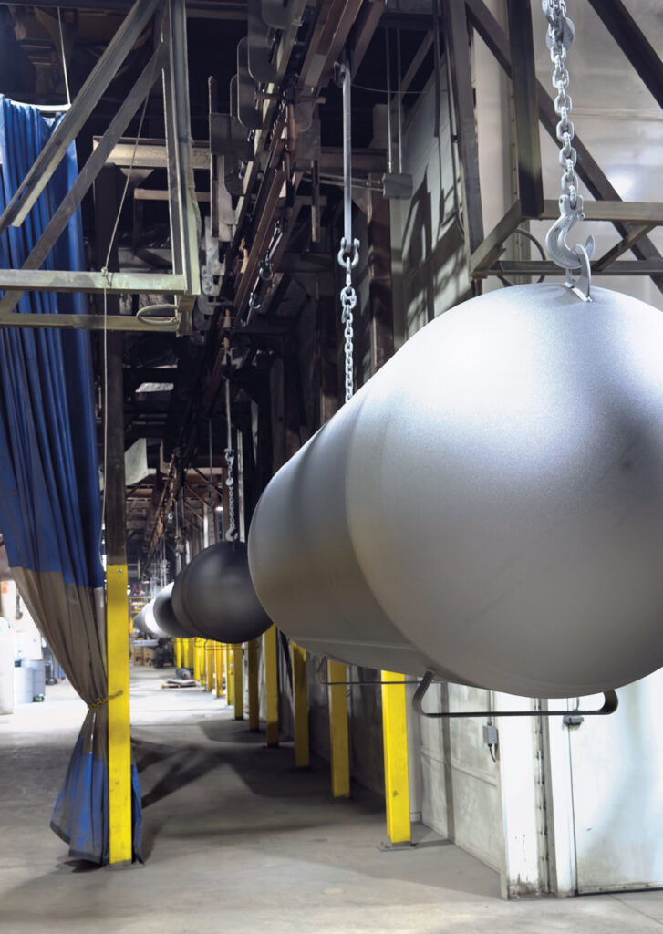 Tanks are on the move from the shot blast process to the paint ovens and booth. (Photo by Shirnae Richardson)