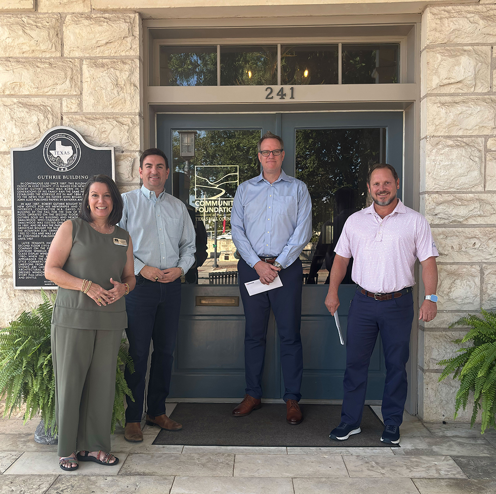 Group photo, in front of the Community Foundation of the Texas Hill Country building, courtesy of Navien Inc.