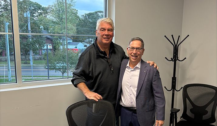 Bob Burger (left) and Joe Armentano celebrate Paraco Gas' acquisition of North Shore Bottled Gas. (Photo courtesy of Paraco Gas)