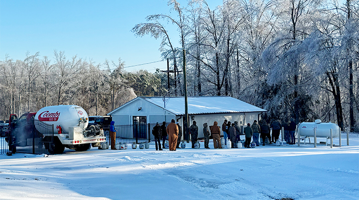 Photo of people lined up for propane cylinder fills