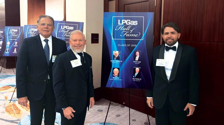 Empire Gas leaders walk through the history of the Hall of Fame, with each previous class presented on posters inside and outside the ballroom. (Photo by LP Gas Staff)